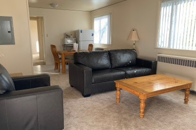 Tres Casitas living room to dining room with carpet
