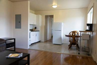 Tres Casitas living room to dining room with wood floor